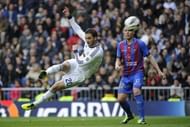 Real Madrid's forward Gonzalo Higuain (L) scores in Madrid on April 6, 2013